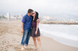© TheVisualsYouNeed - young beautiful and happy mixed ethnicity couple of Asian woman and Caucasian man relaxed and cheerful walking playful  on beach enjoying love and romantic holidays