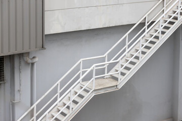 Poster - fire escape stair steel. white outdoor metal stair of building.