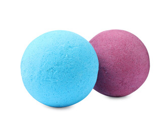 Two bright bath bombs on white background