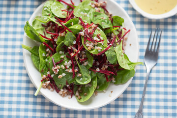 Wall Mural - Bulgur, beetroot and spinach salad with vinaigrette sauce. 