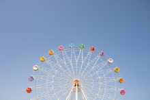 Ferris Wheel On A Blue Sky