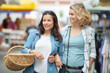 © auremar - two friends at farmers market looking for organic groceries