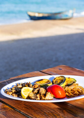 Wall Mural - Grilled rapana dish on Black Sea, Vama Veche - Romania