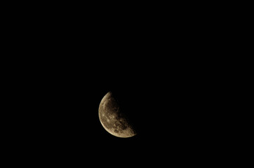 half moon telephoto on dark sky