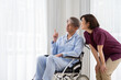 © ponta1414 - 介護士と車いすに乗ったシニア男性