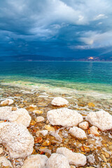 Wall Mural - The sun illuminates the Jordanian coast