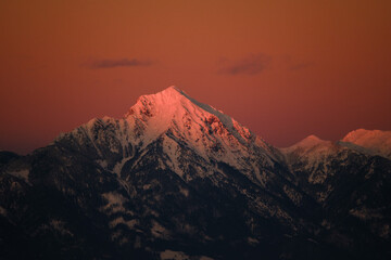 Canvas Print - Storzic mountain in red sunset in Slovenia