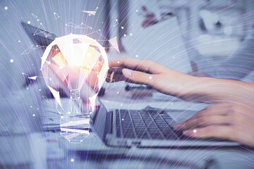 Poster - Double exposure of woman hands typing on computer and light bulb drawing. Idea concept.