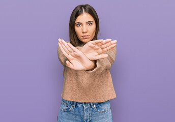 Sticker - Young beautiful woman wearing casual clothes rejection expression crossing arms and palms doing negative sign, angry face