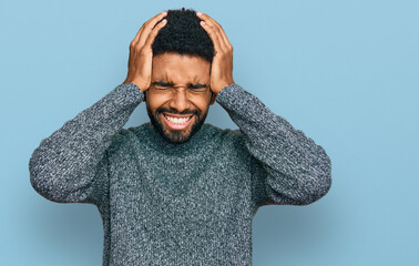 Canvas Print - Young african american man wearing casual clothes suffering from headache desperate and stressed because pain and migraine. hands on head.