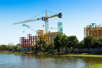 Crane for construction site equipment on blue sky background