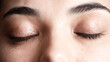 Close up shot of a pair of closed woman's eyes