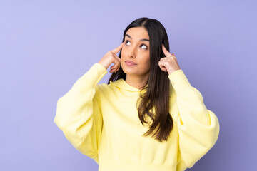 Young caucasian woman over isolated background having doubts and thinking