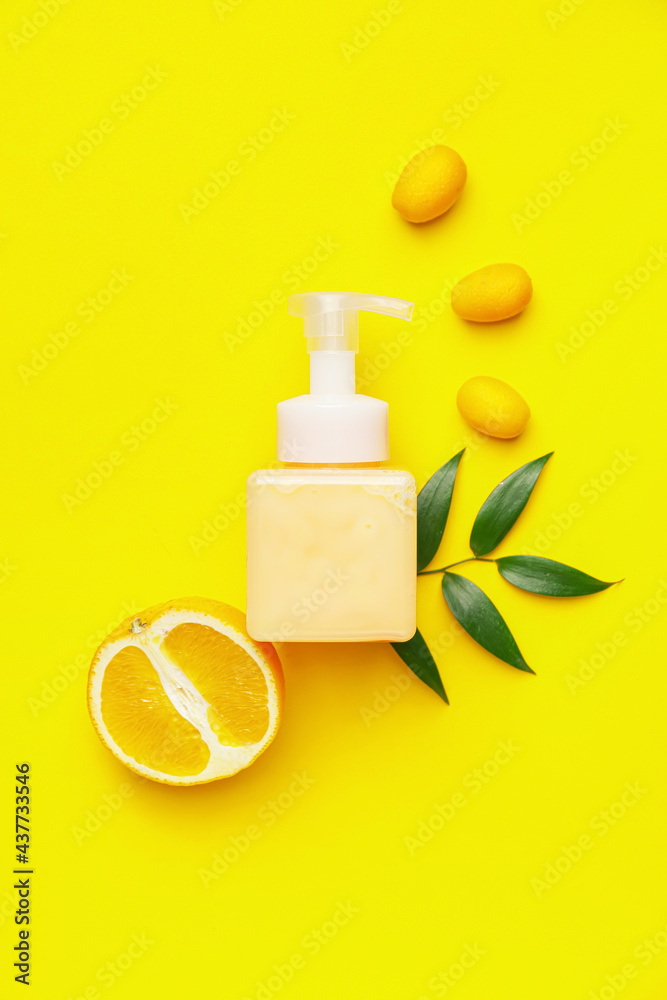 Bottle of natural cosmetics with citrus fruits on color background - obrazy, fototapety, plakaty 