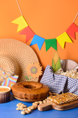 Traditional food for Festa Junina (June Festival) on color background