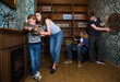 © JackF - Friendly family with children is trying to find a solution to the puzzle in the confined space of a lost room