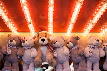 Stuffed toy bears on display awarded as winning prizes at Christmas funfair winter wonderland in London