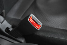 Word Press On A Seat Belt, Close-up, Transportation Safety Concept Background, Black Seats