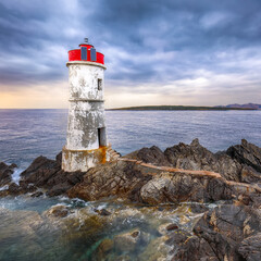 Wall Mural - Dramatic gloomy view of Capo Ferro Lighthouse.