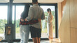 © Epic_pic - Back view of successful real estate agent woman making presentation of house