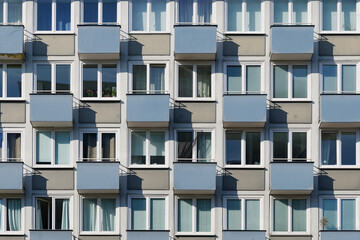 Wall Mural - Outdoor exterior front view of modern facade with typical rectangular windows with reflection glass and balconies