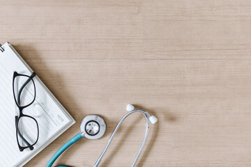 Top View of Doctor Workspace With Stethoscope and Personal Equipment on Table Desk, Above View of Doctor Working Space at Clinic Hospital. Health Medical Occupation and Business Healthcare Concept