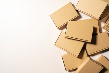 Wall Mural - Cardboard boxes placed on a beige background.