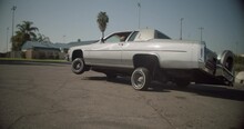 Grey Lowrider Driving On 3 Wheels In Compton California Slow Motion Shot On RED Camera