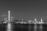 Fototapeta Miasta - Panorama of skyline of Victoria harbor of Hong Kong city at dusk