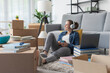 © StockPhotoPro - Woman relaxing in her new home