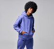 Portrait of black man in track suit with circle afro hair