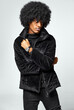 Photo of handsome black man in black velvet jacket with watch on hand