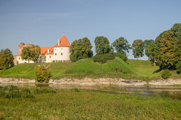 Wall Mural - Bauska city castle in Latvia up in the hill. Sunny autumn day.