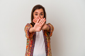 Middle age caucasian woman isolated on white background doing a denial gesture