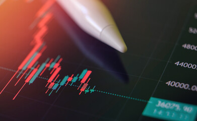 Analysis of business chart and online data in financial volatile market with digital pen - Crisis graph close up background