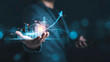 © Dilok - Businessman holding virtual technical graph and chart for analysis , stock market and trader concept.