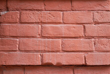 A Fragment Of A Red Brick Wall. The Texture Of The Stone.