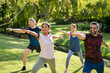 © Rido - Group of mature men and women stretching at park after workout