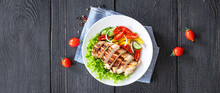 Salad Grilled Chicken Breast Vegetables Tomato, Cucumber, Onion Mix Poultry Meat Organic Dish On The Table Healthy Food Meal Snack Copy Space Food Background Rustic. Top View Keto Or Paleo Diet