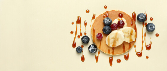 Wall Mural - Concept of tasty food with pancake on beige background