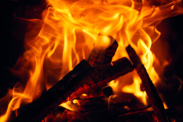 A fire burns in a fireplace, Fire to keep warm. Logs burning in a fireplace