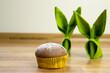 Single Muffin in yellow wrapping with Easter decoration