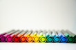 Colourful pencils in a row