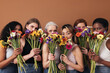 © Artem Varnitsin - Group of diverse women hide their faces by bouquets of flowers. Portrait of six females of a different race, age, and figure type.