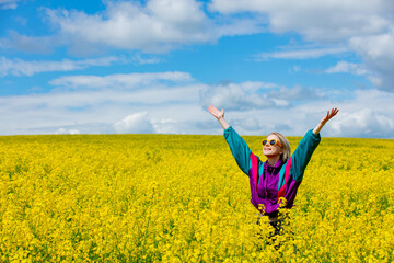 Sticker - Beautiful woman in vintage tracksuit in yellow rapeseed field