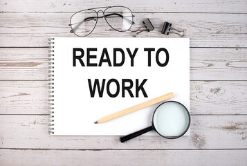 Poster - Notebook with text READY TO WORK on the wooden table with pen, magnifier and glasses