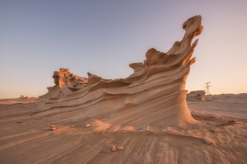 Wall Mural - Desert eroded rock pattern with clear sky. Desert rock formation with erosion close up shot.