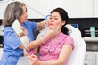 © JackF - Highly qualified cosmetology doctor carefully examines the face of a young woman patient before the mesotherapy ..procedure
