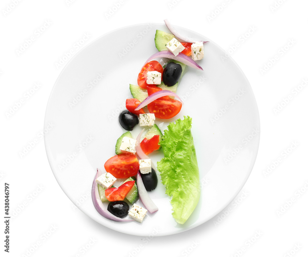 Plate with tasty Greek salad on white background