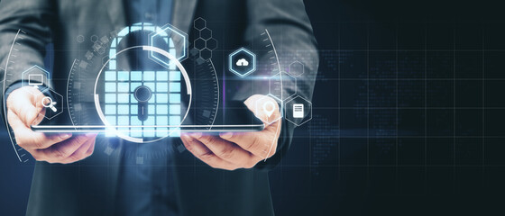 Poster - Internet technology and privacy protection concept with virtual lock sign on man with digital tablet background and copyspace for your logo. Mockup